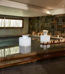Serene indoor spa with ambient lighting and decorative candles.