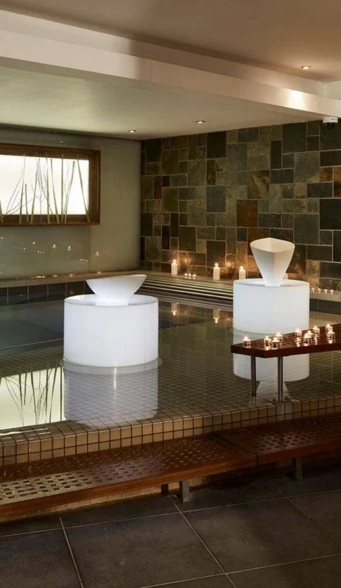 Serene indoor spa with ambient lighting and decorative candles.