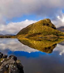 Stunning lake reflection in a serene mountainous landscape.