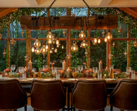 Cosy dining room with festive decorations and an inviting table set for a family gathering.